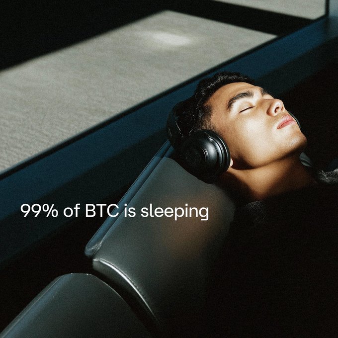 The image shows a man wearing headphones, possibly listening to music or white noise, while laying down with his eyes closed. The text above him reads "99% of BTC is sleeping". This suggests that the man might be using Bitcoin as an investment or payment method and is taking advantage of its anonymity and low transaction fees by sleeping peacefully without any concerns about his digital assets being traced.

The image also includes a couch in the background, which further supports the idea that this scene takes place indoors, possibly at home or in a hotel room. The man's position on the couch with headphones suggests he is comfortable and relaxed while using Bitcoin as part of his daily routine.