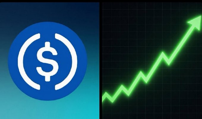 The image depicts a $1 Billion USDC coin that has just been minted and is becoming available to investors. The upward-pointing arrow represents the direction of growth, indicating an increase in value over time. The Bitcoin chart displayed on the right side shows positive numbers, signifying the cryptocurrency's appreciation against the dollar, which suggests the USDC coin could be a good investment choice for those looking to invest in digital assets or cryptocurrencies.