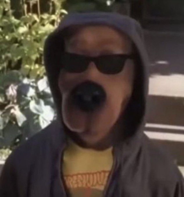 A person wearing a hoodie and sunglasses stares seriously into the camera with pursed lips, evoking a tough or streetwise persona often used to convey confidence in financial trading posts—fitting the message about a Bitcoin short position. The visible text "RESYUNK" on their yellow shirt (likely a Playboi Carti "Whole Lotta Red" merch reference) reinforces the edgy, hypebeast aesthetic paired with the boastful crypto trading flex.