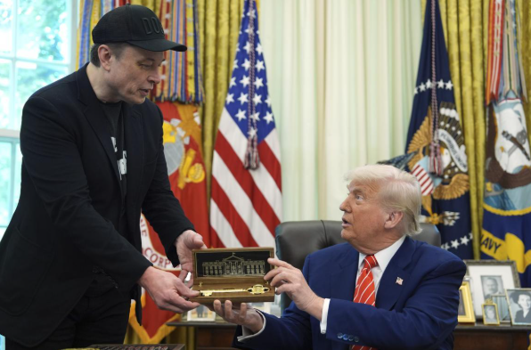 Elon Musk, wearing a black cap with "DOOM" written on it, presents a golden key and miniature White House replica to Donald Trump. The image relates to the post by showing Musk, associated with "X MONEY," presenting what appears to be a "Golden Key," potentially linking to the idea of access or control in the context of "XLM."