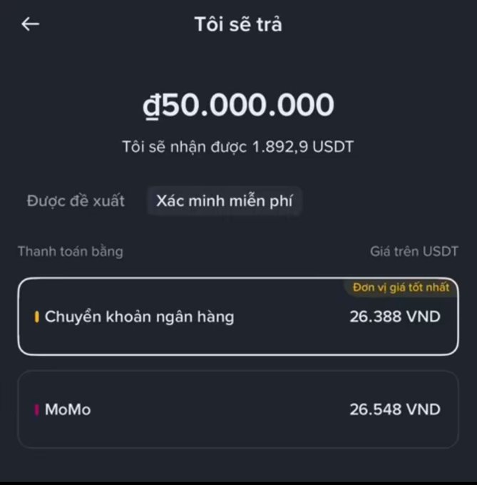 A mobile cryptocurrency exchange app screen in Vietnamese showing a payout of 50,000,000 VND for 1,892.9 USDT, with payment options including bank transfer (26,388 VND) and MoMo (26,548 VND).