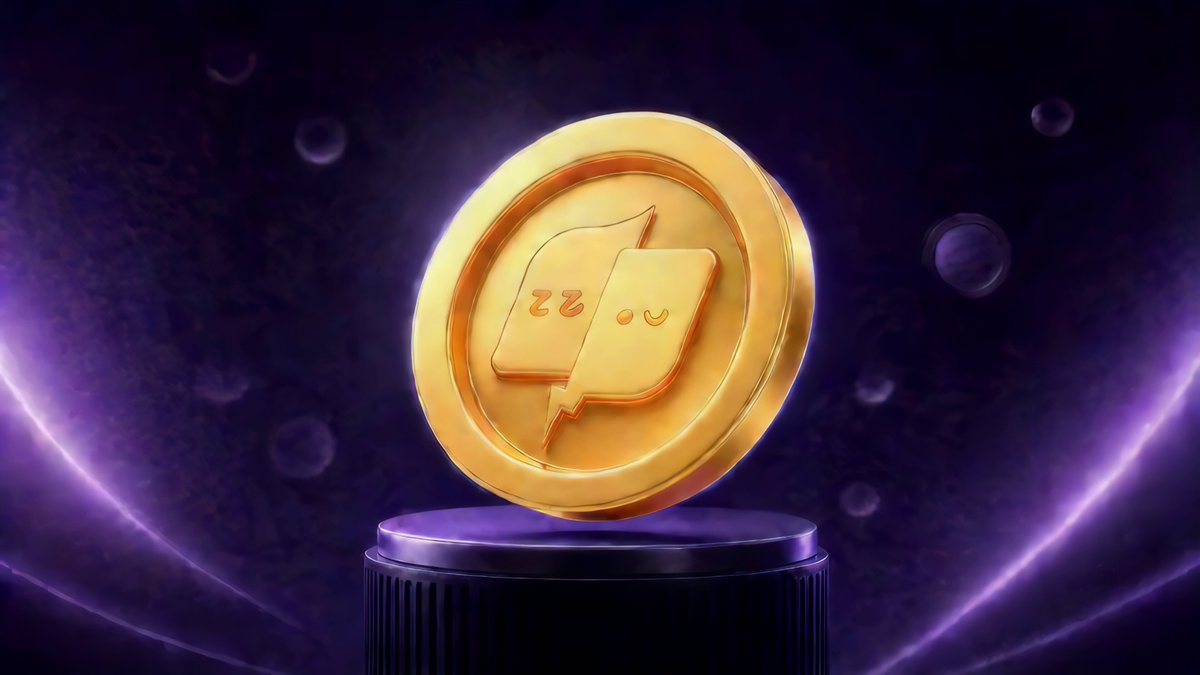 The image features a gold coin with two squares or icons on each side, resembling a Rubik's cube. The coin is set against a dark purple background that looks like a swirling galaxy. There are numerous small circles floating around the edges of the image, which could be particles in space or bubbles related to the coin-playing game Kizzy Memecoin Mania. In the bottom right corner of the image, there is text providing details about the game and the prizes available for players who win it.