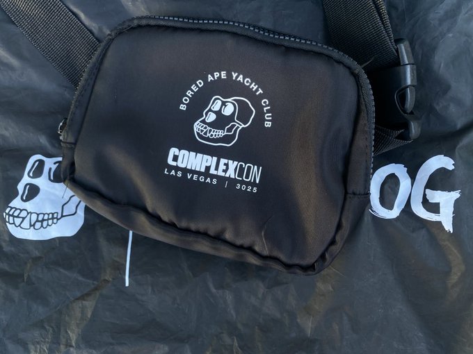 A black Bored Ape Yacht Club (BAYC) crossbody bag with a label reading "COMPLEXCON LAS VEGAS | 2025."