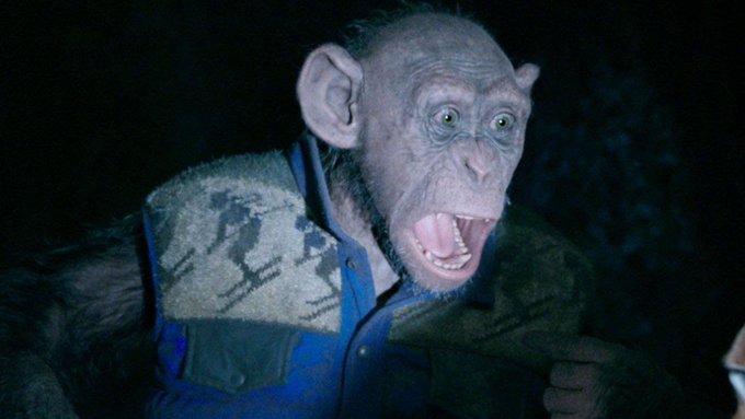 The image features an animated cartoon monkey wearing a blue shirt, sitting against a dark background. The monkey appears to be making a funny face or gesture, possibly imitating human behavior. The caption of the image reads "and i went back and forth with the AI for a few hours." This suggests that someone has been interacting with the monkey's character in the cartoon, perhaps through voice commands or other means.
