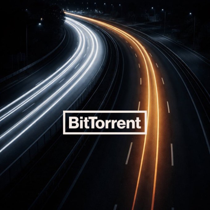 A nighttime highway featuring long-exposure light trails from vehicles, overlaid with the "BitTorrent" logo in bold text. The flowing streams of headlights and taillights visually reinforce the post's message about speed in peer-to-peer networks being a collective achievement.