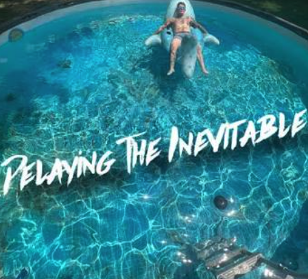A person relaxing on a shark-shaped inflatable in a clear blue pool with the text 'RELAYING THE INEVITABLE' overlaid.