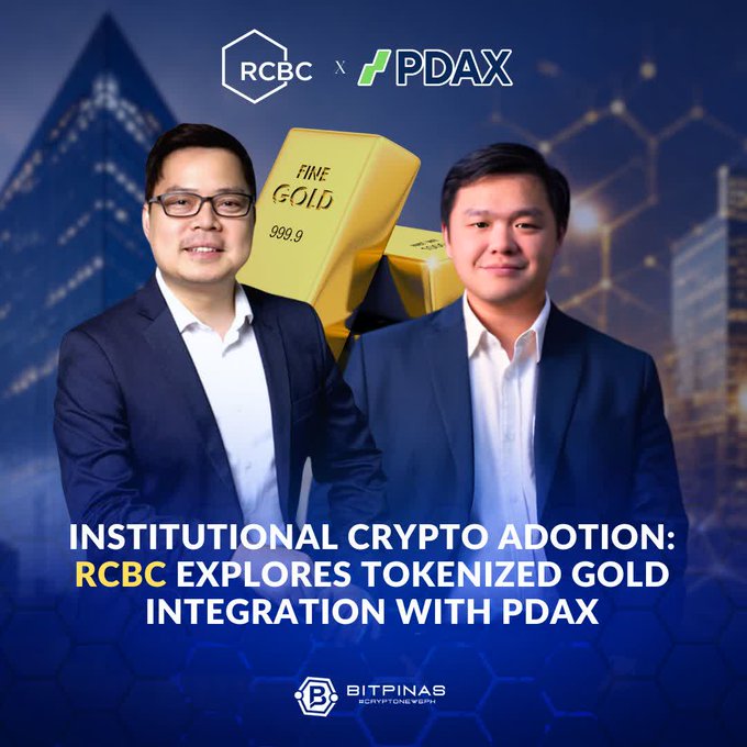 A promotional graphic showing two men in suits with RCBC and PDAX logos, featuring gold bars labeled 'FINE GOLD 999.9' and the text 'INSTITUTIONAL CRYPTO ADOPTION: RCBC EXPLORES TOKENIZED GOLD INTEGRATION WITH PDAX' from BitPinas.