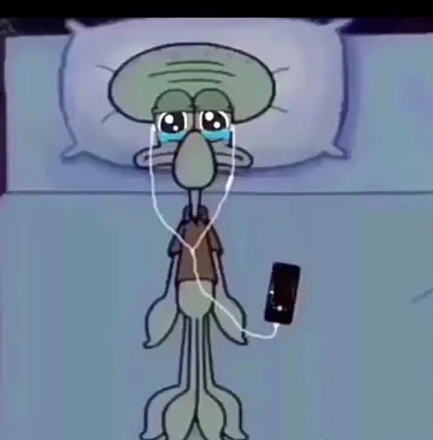A cartoon image of Squidward from SpongeBob SquarePants lying in bed crying with earphones connected to a phone.