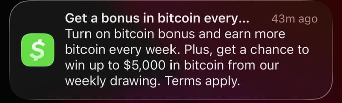 A Cash App notification from 43 minutes ago reads: "Get a bonus in bitcoin every... Turn on bitcoin bonus and earn more bitcoin every week. Plus, get a chance to win up to $5,000 in bitcoin from our weekly drawing. Terms apply." The notification directly corresponds to the Cash App promotional offer, advertising the weekly bitcoin bonus and the $5,000 drawing prize mentioned in the accompanying post.