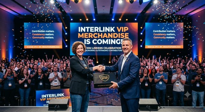 The image shows a celebratory stage event where two individuals shake hands amid confetti, with a large screen announcing "INTERLINK VIP MERCHANDISE IS COMING!" and "TOM LINKERS CELEBRATION," indicating a promotional launch for VIP merchandise tied to the Interlink platform.