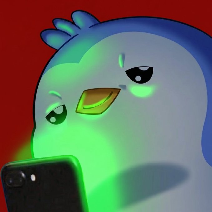 A close-up of an animated blue bird character with glowing green eyes looking down at a smartphone against a red background.