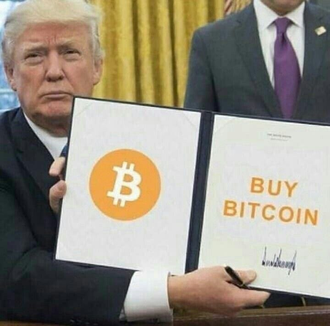 A meme image showing Donald Trump holding a large binder or sign featuring the Bitcoin logo and the orange text 'BUY BITCOIN' with a signature, in what appears to be the Oval Office.