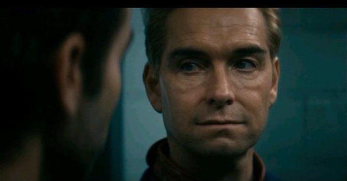 A man stares intently at another person in a dimly lit setting, his expression skeptical and contemplative. The image visually echoes the post's underlying message of suspicion and distrust toward MoonPay's involvement with the Season 2 drop.