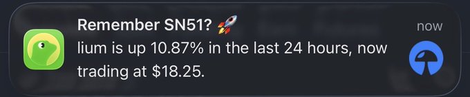 A phone notification from an app reminds the user about SN511, with the text: "lium is up 10.87% in the last 24 hours, now trading at $18.25."