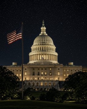 The image shows the U.S. Capitol building illuminated at night with an American flag waving in the foreground and a starry sky overhead, symbolizing the legislative process ahead of the September 15 Senate vote on the Clarity Act. It visually underscores Sen. Cynthia Lummis's call for Democrats to support the bill they helped craft, emphasizing the political stakes in the Capitol.