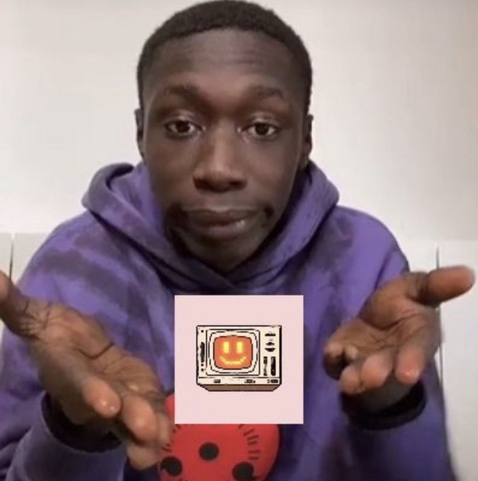 A young man in a purple tie-dye hoodie gestures with both hands open toward the camera, with a vintage TV smiley face sticker overlaid on his chest.