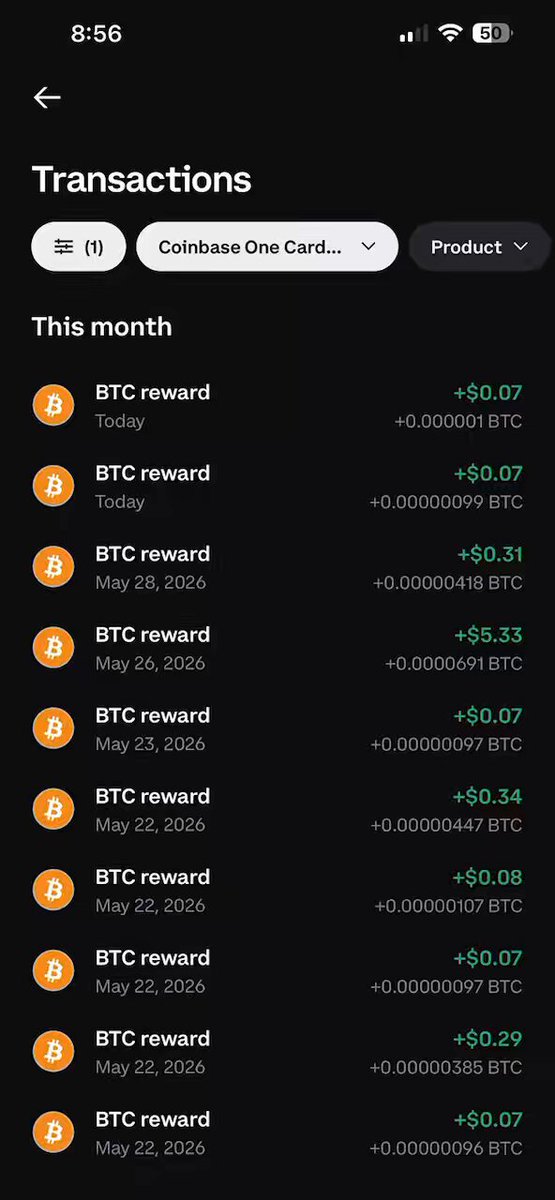 The image shows a phone screen displaying information about transactions made using the Coinbase One Card. The screen has a black background with white text that provides details about the transactions, such as the date, time, amount, and location of each transaction. The transactions are organized in a list format, making it easy to view and understand the data displayed on the phone's screen.