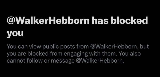 A black screen with white and gray text indicating '@WalkerHebborn has blocked you' and noting that public posts can be viewed but engagement and messaging are restricted.
