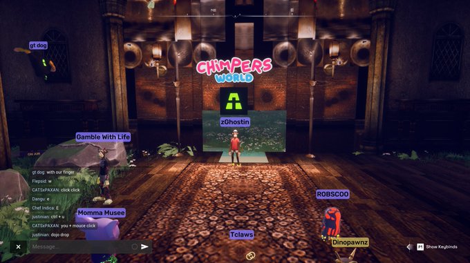 A screenshot of a virtual 3D world called "CHIMPERS WORLD" showing avatars in a large hall, with usernames like "zGhostin", "ROBSCOO", and "Momma Musee" floating above their heads.