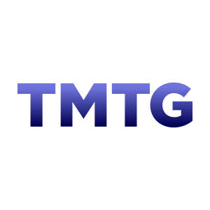 The image displays a logo featuring the letters "TMTG" in bold blue and dark purple gradient text, representing Trump Media & Technology Group. The logo relates to the post, which discusses Trump Media's strategic pivot away from its Crypto.com partnerships to refocus on Truth Social and its planned TAE merger.
