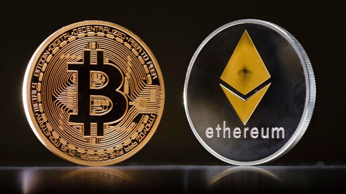 Two physical cryptocurrency coins displayed against a black background, representing Bitcoin (gold-colored with the "₿" symbol) and Ethereum (silver and yellow with the "ethereum" label).