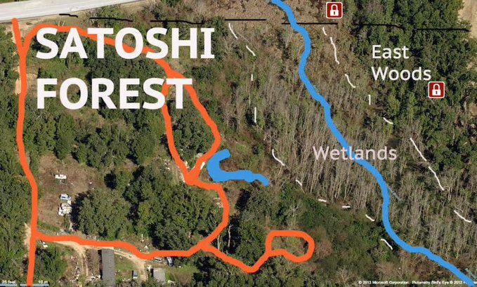 An aerial map outlines "SATOSHI FOREST" in orange, adjacent to "East Woods" and "Wetlands" areas marked in blue, with scale markers showing 25 feet and 15 meters. The image appears to depict the location of Sean's Outpost, a homeless outreach founded by Jason King using Bitcoin funds to support people experiencing homelessness in Pensacola, Florida.