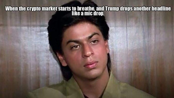 A young man with dark hair gazes calmly at the camera with a composed expression, accompanied by the caption "When the crypto market starts to breathe, and Trump drops another headline like a mic drop." The image humorously captures the anxious, on-edge mood of crypto traders waiting to see how a Trump-related headline impacts #btc, #eth, and #altcoins.