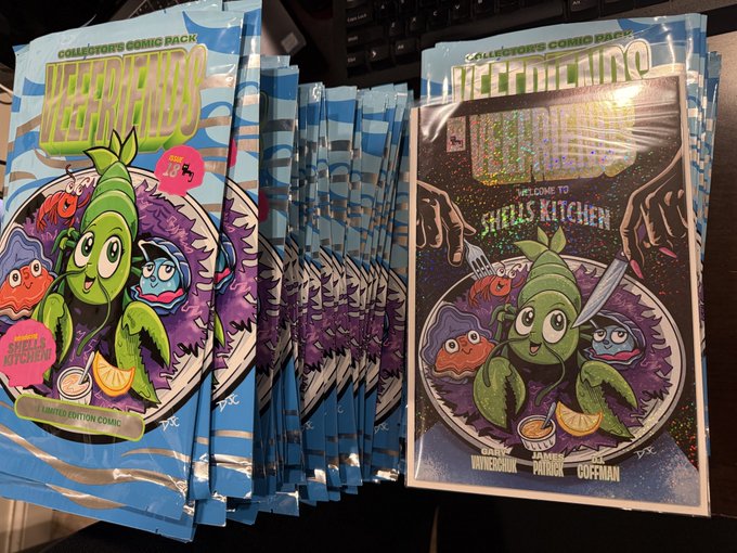 A pile of sealed 'Collector's Comic Pack' merchandise for 'MEMKING' featuring colorful cartoon characters, with a holographic variant cover reading 'Welcome to Shell's Kitchen' on top.