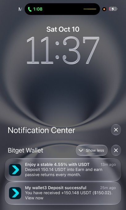 A smartphone lock screen screenshot showing the time 11:37 on Saturday October 10, with notification center open displaying two Bitget Wallet alerts about a 4.55% USDT earn deposit and a successful wallet deposit of +150.148 USDT.