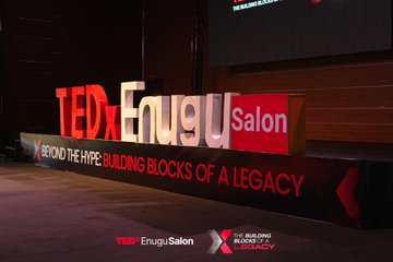 A large illuminated "TEDx Enugu Salon" sign stands on stage with the event theme "Beyond the Hype: Building Blocks of a Legacy" displayed below, matching the post's reference to Kaspa Nigeria's in-person appearance at TEDx on June 27.