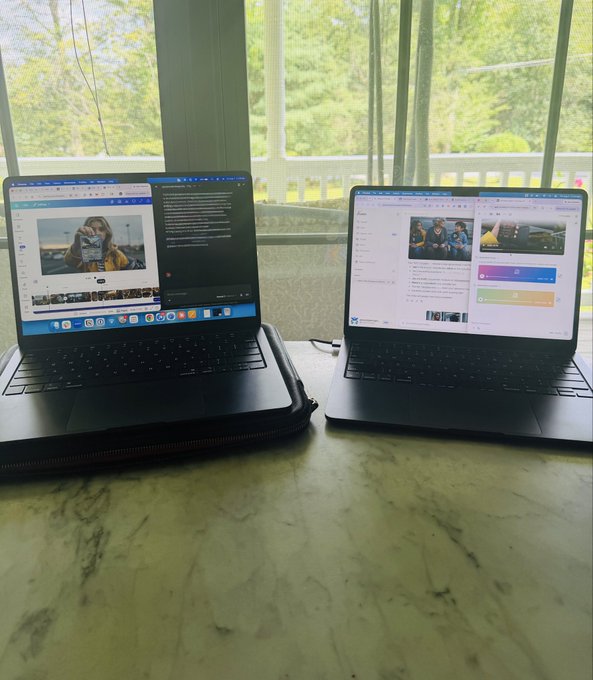 Two laptops sit on a marble surface by a large window overlooking green trees, one displaying what appears to be Lumara Film Festival content with prize information, illustrating the festival's accessibility and the at-home participation opportunity for aspiring filmmakers.