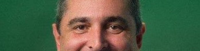 A close-up cropped photo shows a man's face (from eyes to forehead area) smiling at the camera against a green background. The image itself doesn't contain any visible text or relate directly to the $TOAD giveaway announcement, suggesting it's likely just a profile photo attached to the post.