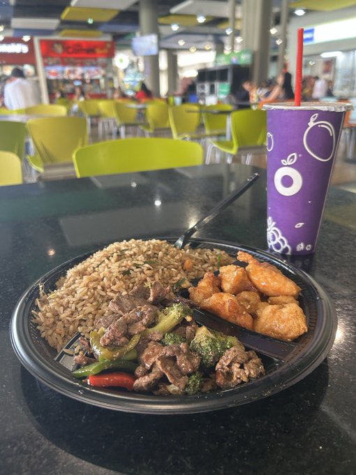 A hibachi-style combo plate with fried rice, beef and broccoli, and sesame chicken is served at a food court alongside a purple bubble tea drink. The meal fits the "Chinese for dinner!" caption perfectly, with the food court setting suggesting a quick Asian-style takeout meal.