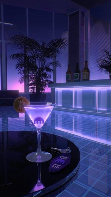 A glowing purple cocktail with a martini glass sits on a reflective black table beside a key tag reading "2151 Pool Hotel" in a neon-lit poolside lounge, setting a sleek, atmospheric scene that complements the post "GN" as a stylish goodnight message.