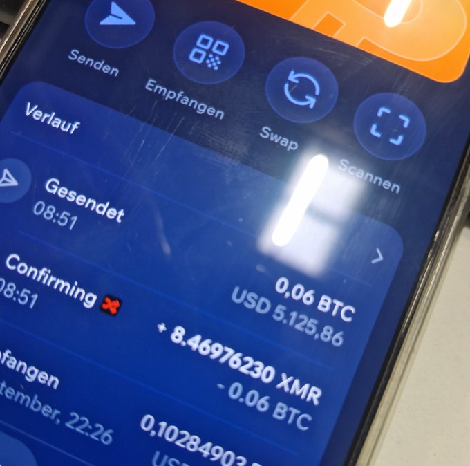 A smartphone screen displays a crypto wallet transaction history showing a swap of 0.06 BTC ($5,125.86) for 8.46976230 XMR Monero, with a "Confirming" status. The image illustrates the author's shift from Bitcoin accumulation toward privacy-focused crypto like Monero ($XMR), reflecting the changing goals mentioned in their post.