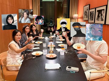 A group of people sit around a dining table eating a meal, with their faces obscured by various anime character illustrations and other images overlaid on the photo.
