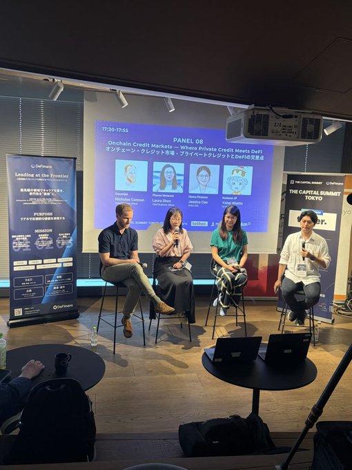 A panel discussion at 'THE CAPITAL SUMMIT TOKYO' featuring four speakers on stage discussing 'Onchain Credit Markets – Where Private Credit Meets DeFi', with founder photos displayed on the screen behind them.