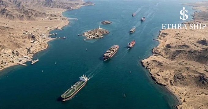 An aerial photograph of several large cargo and oil tankers navigating through a narrow waterway surrounded by arid, desert mountains, featuring the 'ETHRA SHIP' logo in the top right corner.