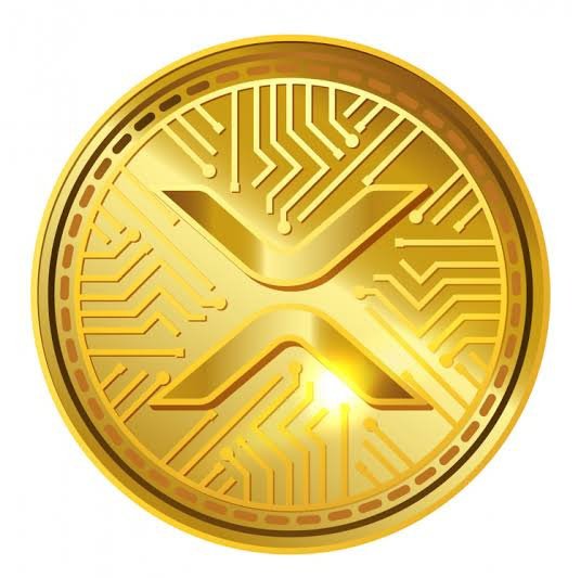 A gold cryptocurrency coin with a digital 'X' logo and circuit board patterns is shown against a white background, representing the XRP token.