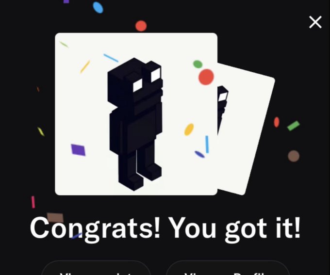 A dark-themed app screen displays a congratulations message reading 'Congrats! You got it!' with a black blocky character on a white card and confetti scattered in the background.