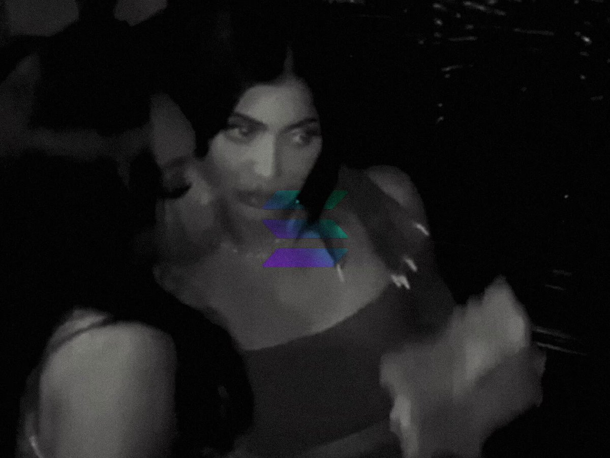 The image shows a close-up of two women, one wearing a black tank top with purple lettering and the other wearing a white shirt. They are both looking at the camera, creating an interesting visual dynamic between them. The photo appears to be in black and white, which adds a timeless quality to the scene. The caption "Solana Summer 2026" suggests that this image might have been taken during Solana's summer event or gathering.