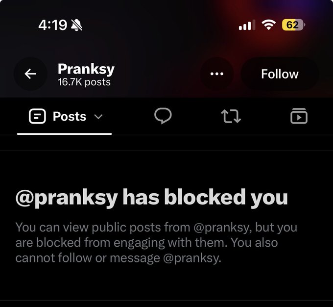 A screenshot of a social media profile for 'Pranksky' (16.7K posts) showing a message that reads '@pranksky has blocked you', noting the user can view public posts but cannot engage, follow, or message.