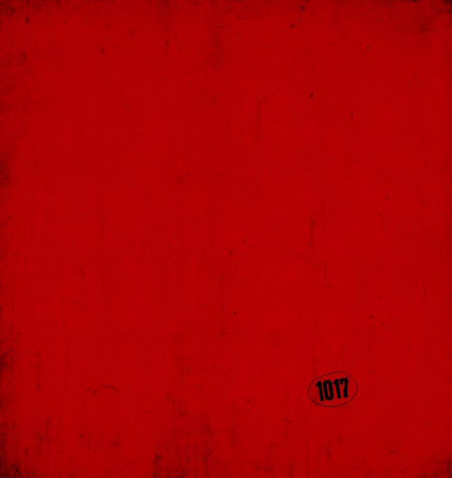 The image features a red background with a black and white sticker placed at the bottom right corner, which reads "1077". The text "Gm Fam Happy Fridayyy Who's going to Ape fest wherever it is?" is also present on the image. This combination of elements suggests that the image might be related to an event or gathering where people are celebrating a special occasion, and the sticker serves as a reminder for those attending.