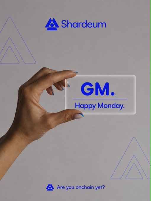 A hand holds a translucent "GM. Happy Monday." card beneath the Shardeum logo, with the tagline "Are you onchain yet?" — pairing a cheerful Monday greeting with a prompt to join the Shardeum blockchain community, matching the "What's up, Shardians?" vibe.
