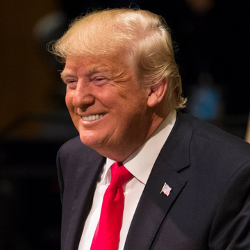 The image shows Donald Trump, whose family is reportedly backing World Liberty Financial ($WLFI), a company that has received preliminary approval to form a national trust bank for a $USD1 stablecoin.