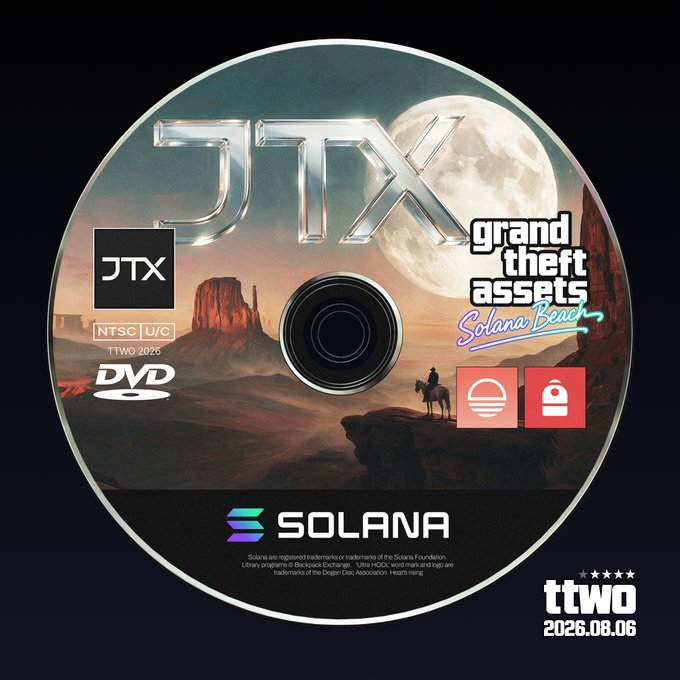 A custom DVD-style disc design featuring desert mesas under a full moon with the "JTX" logo prominently displayed, branded with "Solana Beach" in GTA-style lettering and "Take-Two Interactive" styled text ("ttwo") dated 2026.08.06. The image creatively references the post about Take-Two joining Solana by mimicking a Grand Theft Auto game asset, tying together the gaming giant and the blockchain platform in a single mock release titled "Grand Theft Assets: Solana Beach."