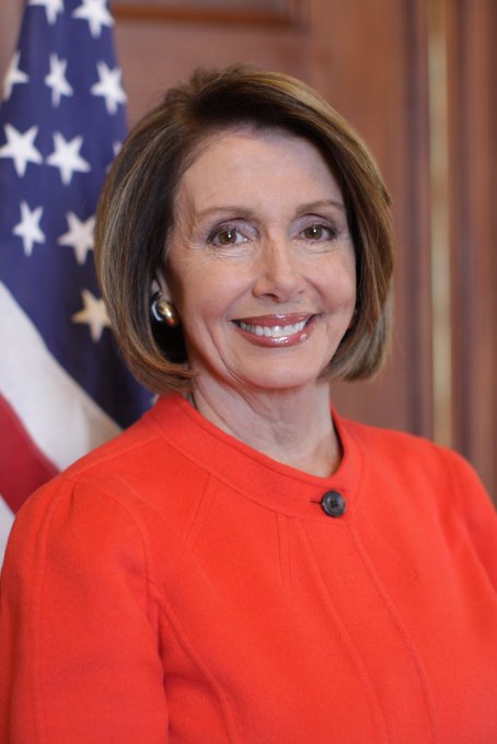 A portrait of Nancy Pelosi, dressed in an orange blazer, is shown with the American flag in the background. The post insinuates she made a profitable stock trade of $VST at $140.