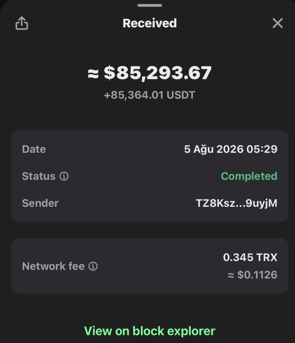 A mobile screenshot showing a completed "Received" transaction of +85,364.01 USDT (≈ $85,293.67) on August 5, 2026, sent from address TZ8Ksz...9uyjM, with a network fee of 0.345 TRX. This image appears to be used as proof of a large payout to lend credibility to a giveaway post claiming to distribute $10,000 ($100 each to 100 winners) via the gambling site stake.mba, likely a scam attempting to impersonate a legitimate transaction to lure users.