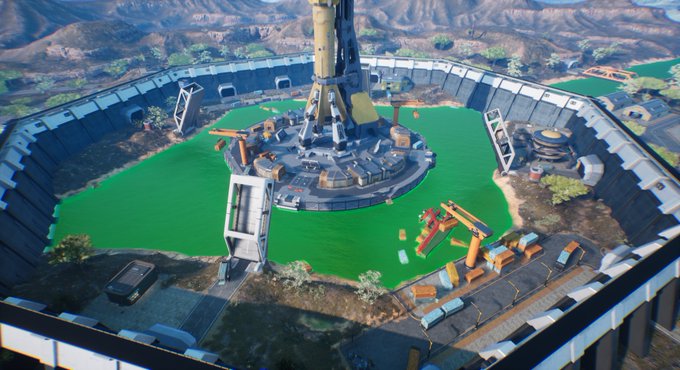 A circular arena with bright green turf is enclosed by walls, featuring a central tower, cranes, and industrial structures around its perimeter. The scene illustrates the Arena Duel Mode gameplay environment referenced in the post, where players enter the arena by paying the 5 USDT entry fee plus BNB gas.