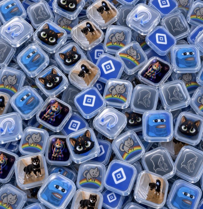 A pile of square transparent icons featuring various blue-themed illustrations including cats, rainbows, dolphins, and stylized faces.